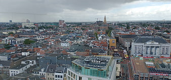 Panoramic cityscape view of European town with church spire