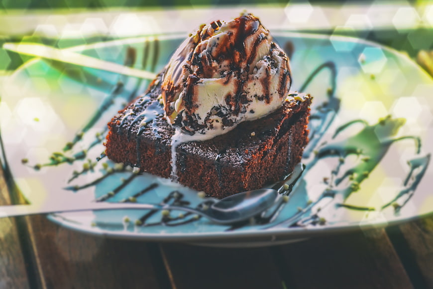 Chocolate Brownie with Ice Cream and Chocolate Sauce on Plate