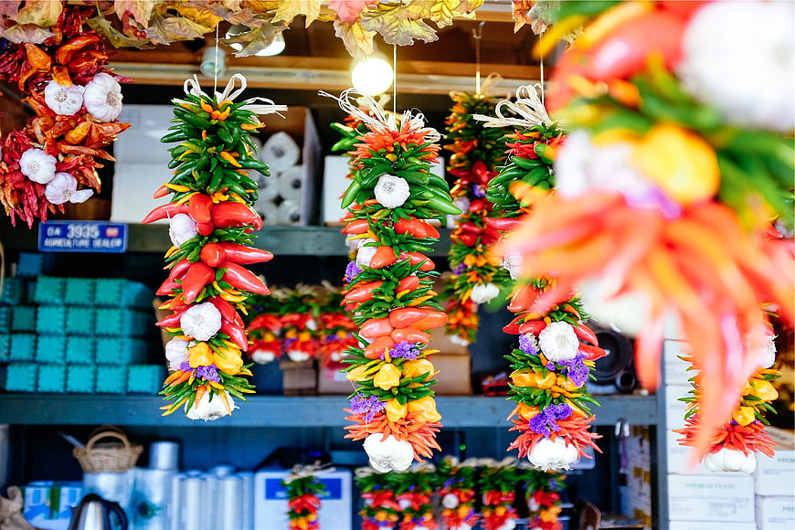 Colorful Hanging Dried Peppers and Garlic in Market
