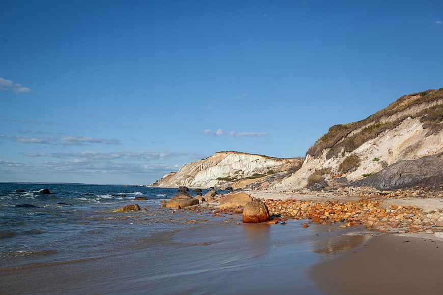 Scenic coastal landscape with white cliffs and rocky beach