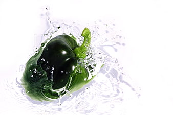 Fresh Green Bell Pepper Splashing in Water