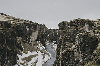 Mossy Canyon with River and Snow Patches