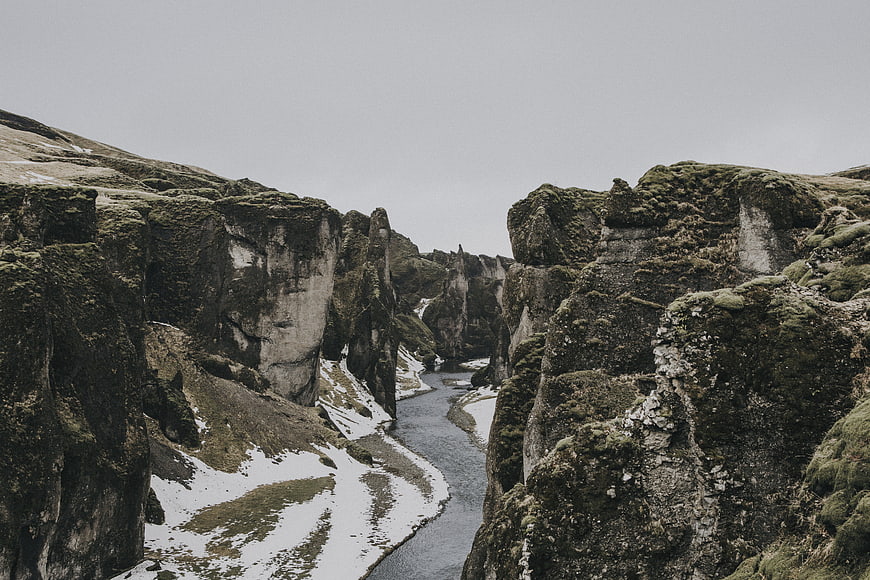 Mossy Canyon with River and Snow Patches