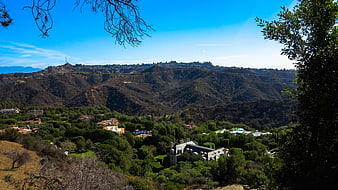 Scenic California Hills with Luxury Estate and Blue Sky