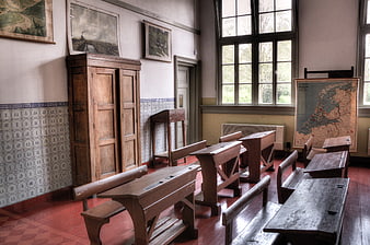 Vintage Classroom Interior with Wooden Desks and Maps