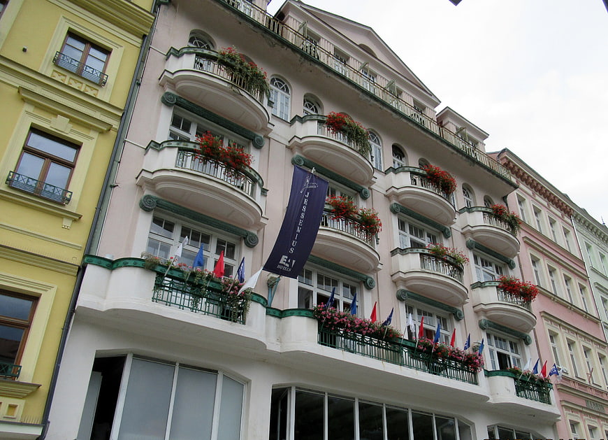 Low angle view of historic European hotel with flower balconies