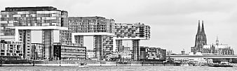 Black and white panorama of Cologne skyline with Kranhäuser and Cathedral