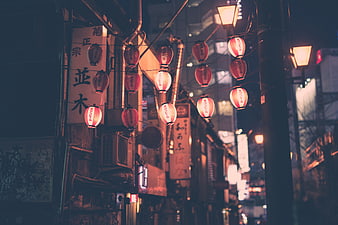 Traditional Japanese Lanterns Hanging on Night Street