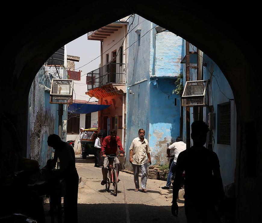 Street Life In Agra India Through Blue Archway