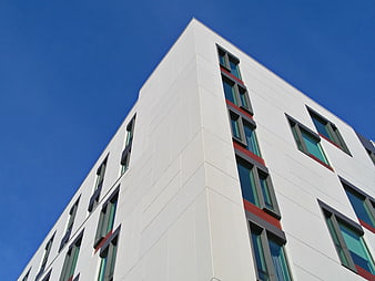 Modern White Building Facade Against Blue Sky