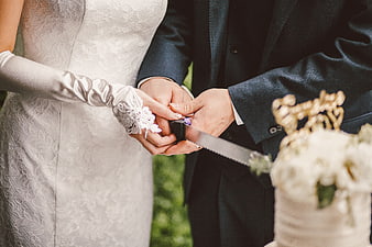 Bride and Groom Cutting Wedding Cake Together