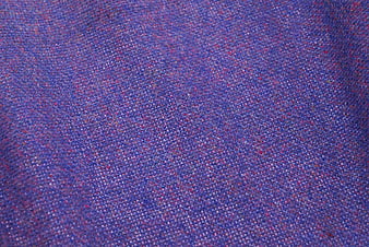Close-up of purple and pink tweed fabric texture