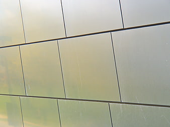 Modern Metallic Wall Facade with Geometric Grid Pattern
