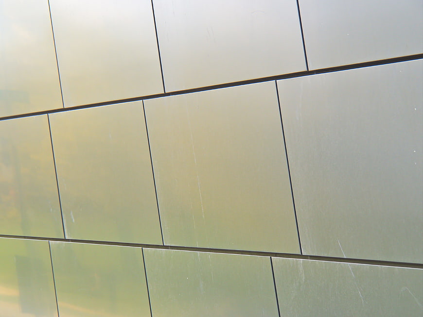 Modern Metallic Wall Facade with Geometric Grid Pattern