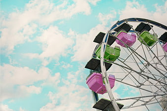 Colorful Ferris Wheel Cars Against Blue Sky