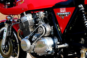 Close-up of Red Honda Motorcycle Engine with Chrome Details