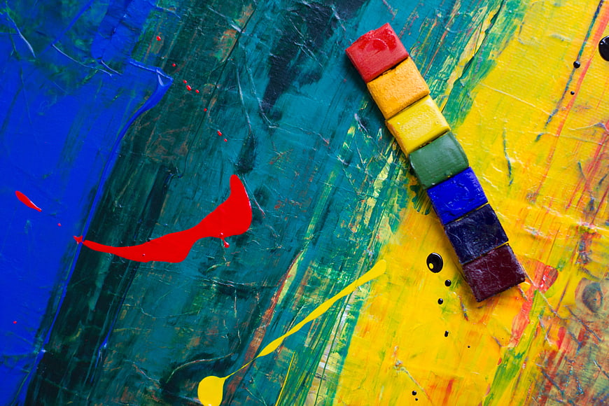 Colorful Oil Pastels on Abstract Painted Canvas Background