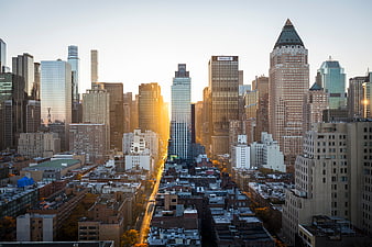 Golden hour cityscape with skyscrapers and urban skyline