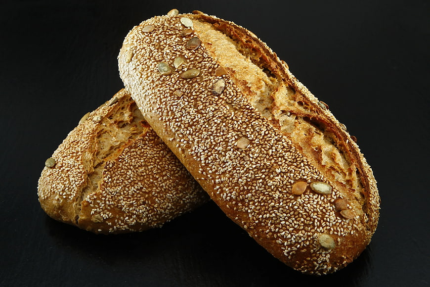Artisanal Seed Bread Loaves on Dark Background