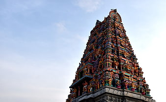 Colorful Hindu Temple Gopuram Tower Against Blue Sky