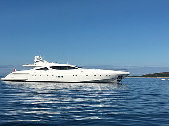 Luxury white yacht anchored in calm blue sea
