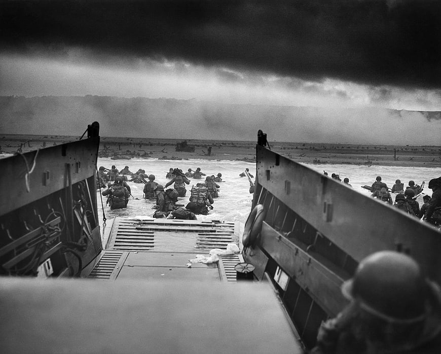 WWII Soldiers Disembarking from Landing Craft onto Beach