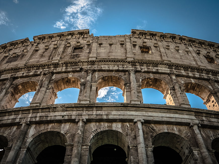 Low Angle View Of The Colosseum Arches And Facade In Rome