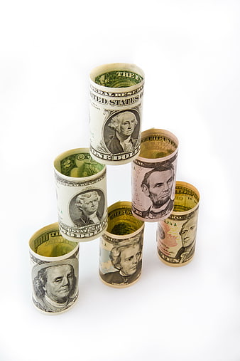 Rolled US Dollar Bills Arranged in a Financial Pyramid Structure