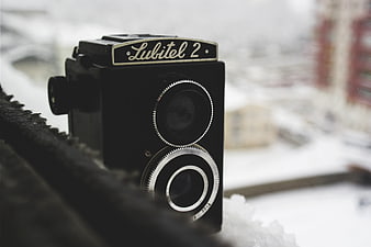 Vintage Lubitel 2 Camera on Snowy Window Sill