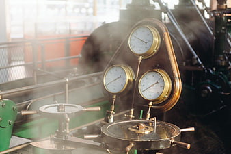 Vintage Steam Engine Gauges and Valves in Industrial Setting