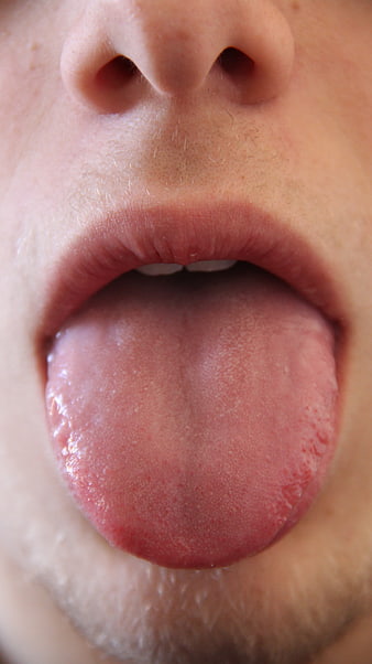 Close-up of human tongue and mouth anatomy