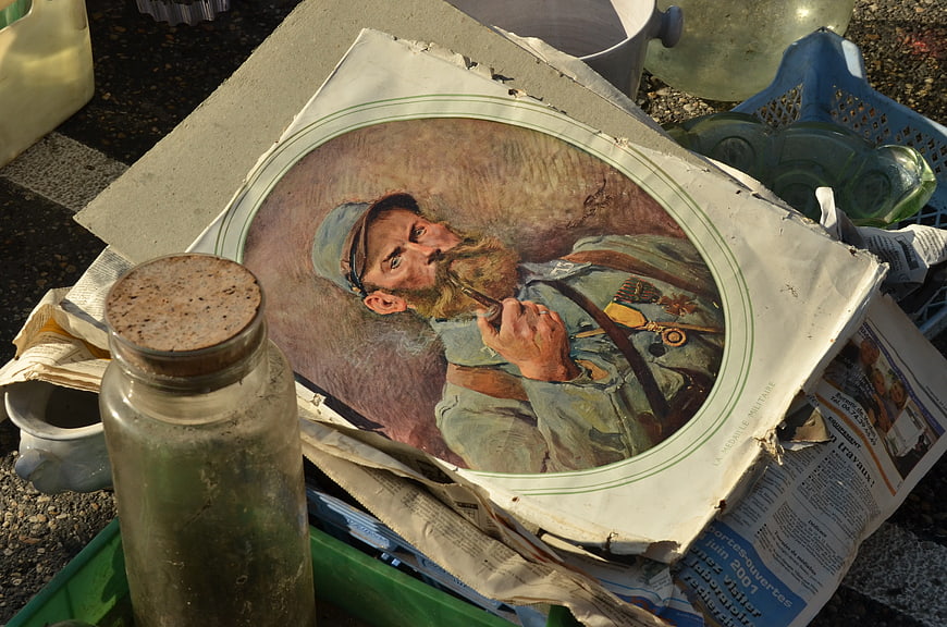 Vintage Portrait of Soldier in Cluttered Flea Market Setting