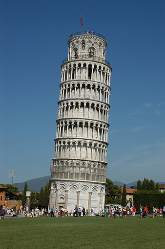 Leaning Tower of Pisa in Italy with tourists on a sunny day