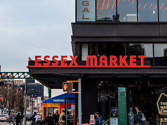 Essex Market Neon Sign on Urban Street Corner