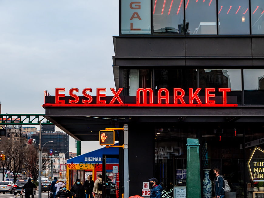 Essex Market Neon Sign on Urban Street Corner