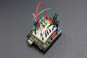 Arduino circuit board with breadboard and LEDs