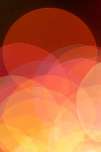 Abstract Bokeh Background with Warm Orange and Red Circles