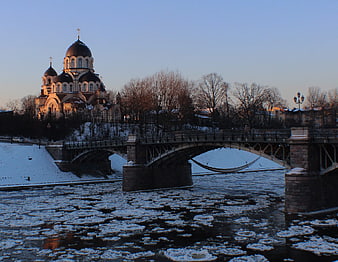 Winter Cathedral and Bridge Over Icy River