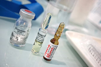 Medical vials and ampoules for injection on clinical table