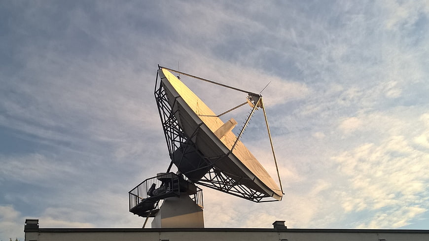 Large Satellite Dish Antenna Against Cloudy Sky