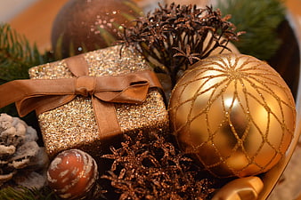 Gold Glitter Christmas Gift Box and Ornament Close-Up