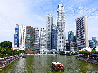 Singapore River Skyline with Skyscrapers and Traditional Boat