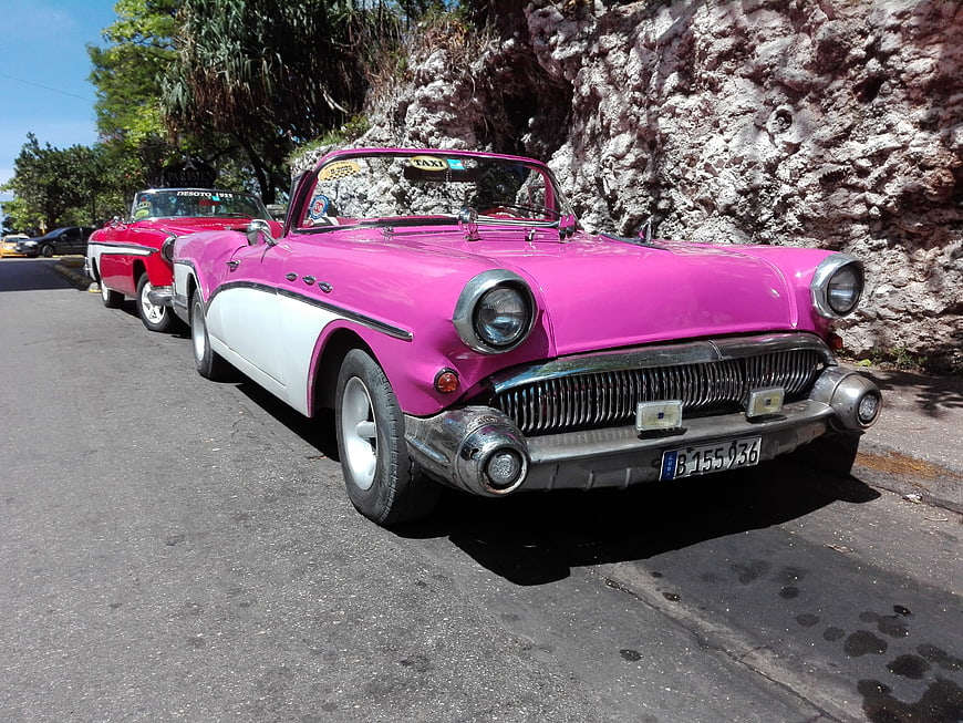 Pink Classic American Convertible Taxi on Street