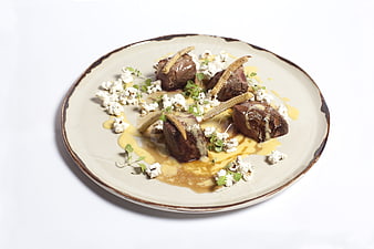 Gourmet Beef Tenderloin with Popcorn and Sauce on White Plate