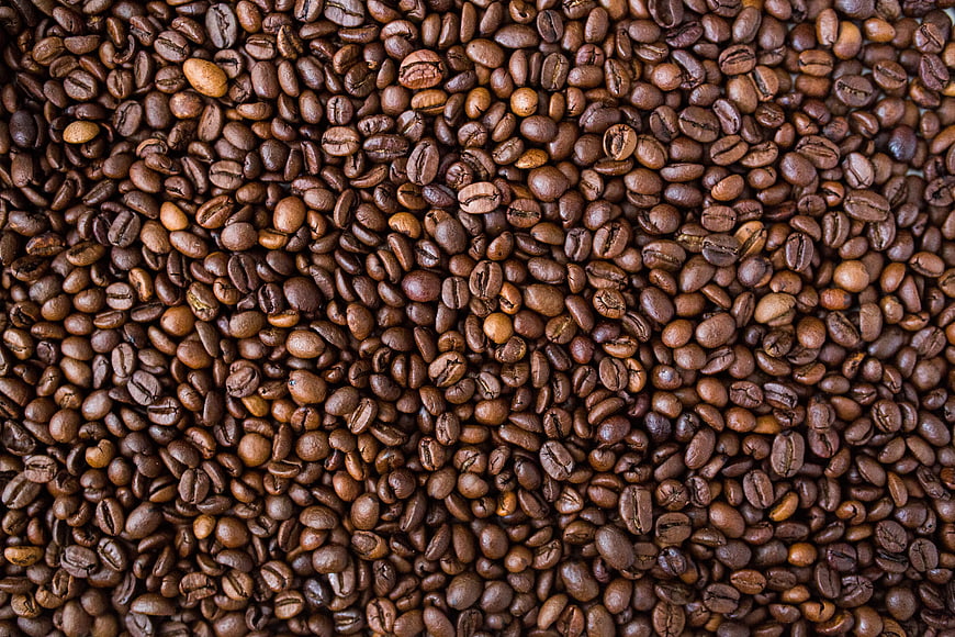 Close-Up Texture of Roasted Coffee Beans Background