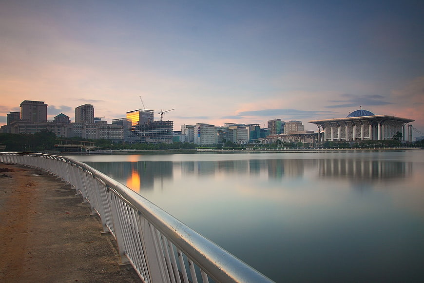 Serene Cityscape Reflection at Dusk with Modern Architecture