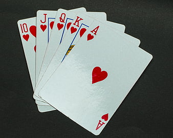 Royal Flush of Hearts Playing Cards on Dark Background