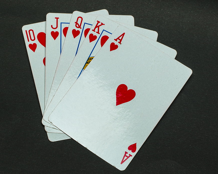 Royal Flush of Hearts Playing Cards on Dark Background