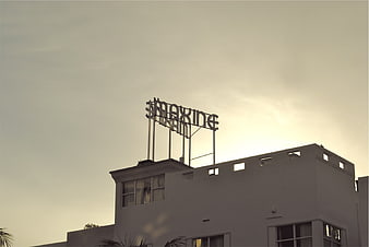 Vintage Maxine Theater Sign Silhouette Against Sepia Sky