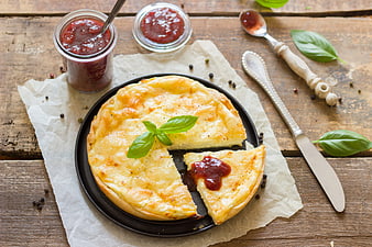 Homemade Quiche Lorraine with Raspberry Jam on Rustic Wood